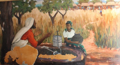 The bible scene with Jesus at the well with the Samaritan woman shows signs of damage and peeling of paint