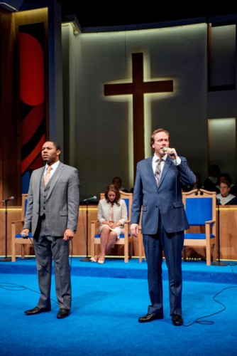 Associate pictured on the left. Pastor Paul on the right, with the mic.